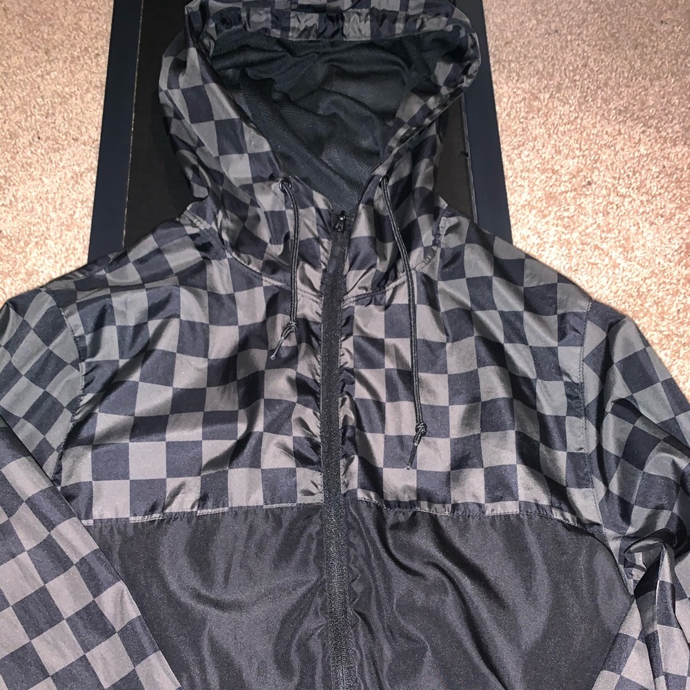 Checkerboard and black zip up windbreaker